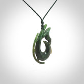Hand carved Jade Hook with whale pendant. Hand carved by NZ Pacific, jade jewellery for sale online.